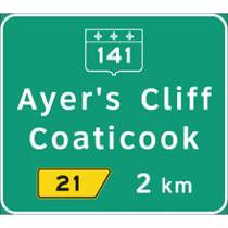 Exemple d'un panneau de destination à l'approche d'une intersection